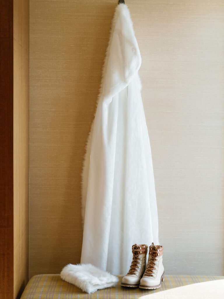 Bride's furry cloak for winter sun valley wedding