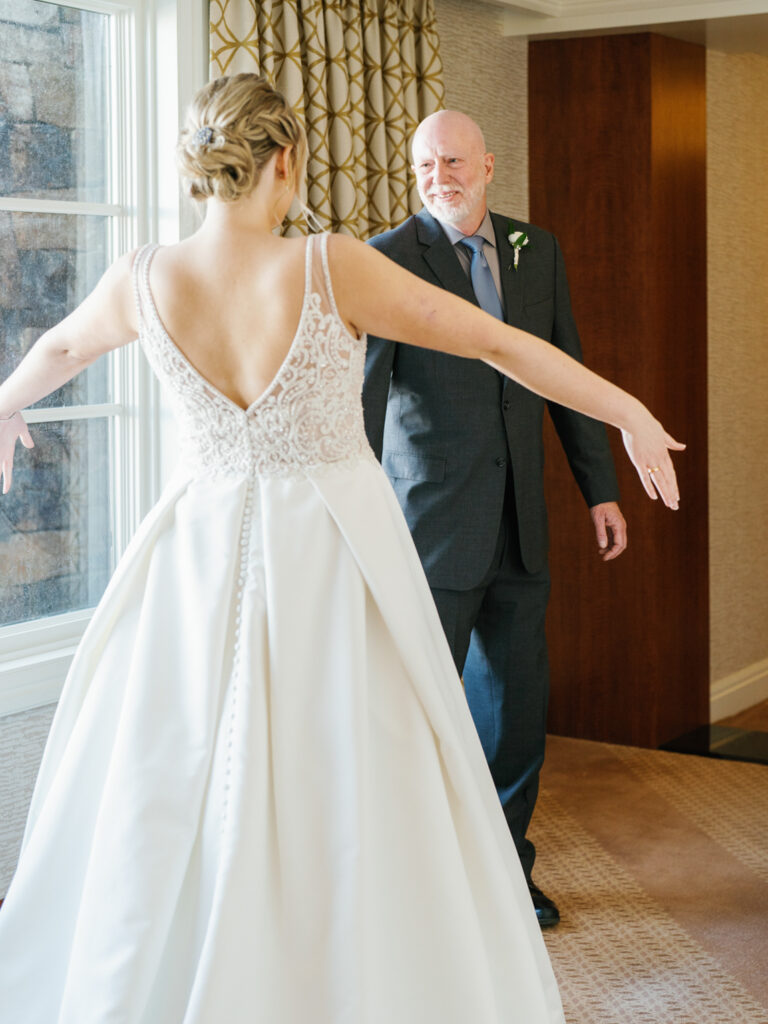A Bride's first Look with her father at Sun Valley Lodge before the wedding
