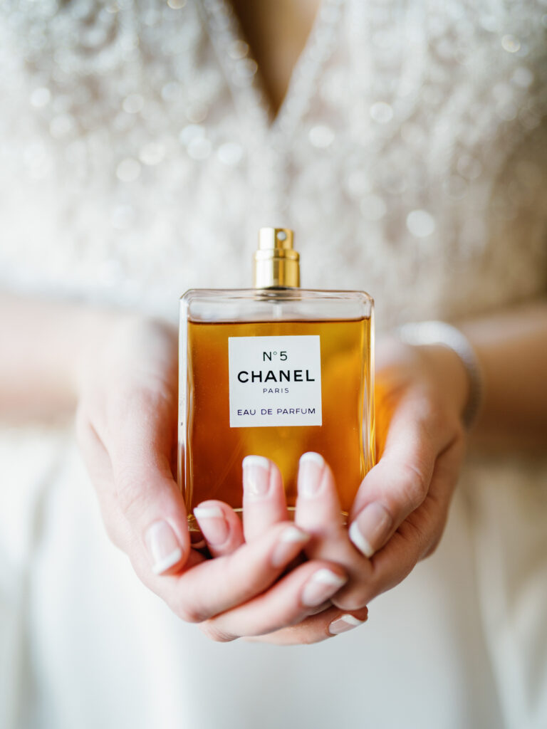 Bride holding Chanel perfume  for Sun Valley Wedding