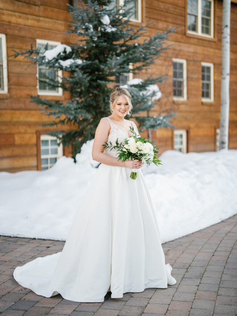 Bridal portraits in front of Sun Valley Lodge in the snow.