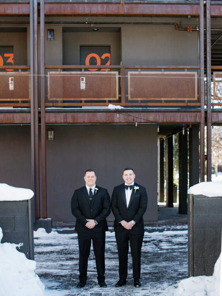 A Groom getting and best man outside Hotel Ketchum for Sun Valley Winter Wedding