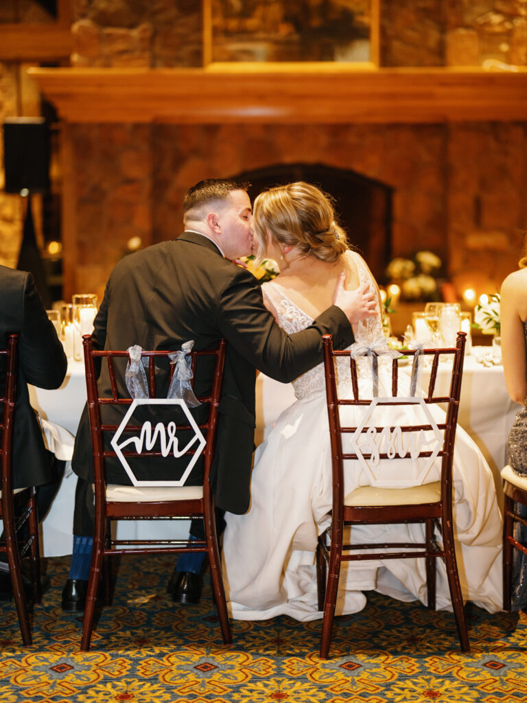Bride and Groom kiss at reception at Sun Valley Club wedding