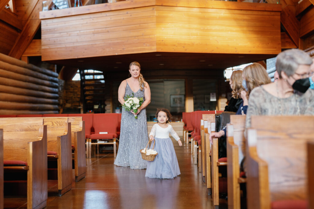 Flower girl during ceremony at Saint Thomas Episcopal Church in Sun Valley