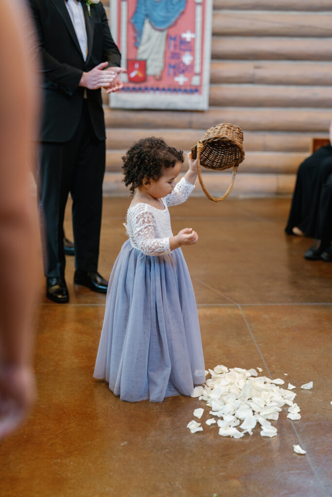 Flower girl during ceremony at Saint Thomas Episcopal Church in Sun Valley
