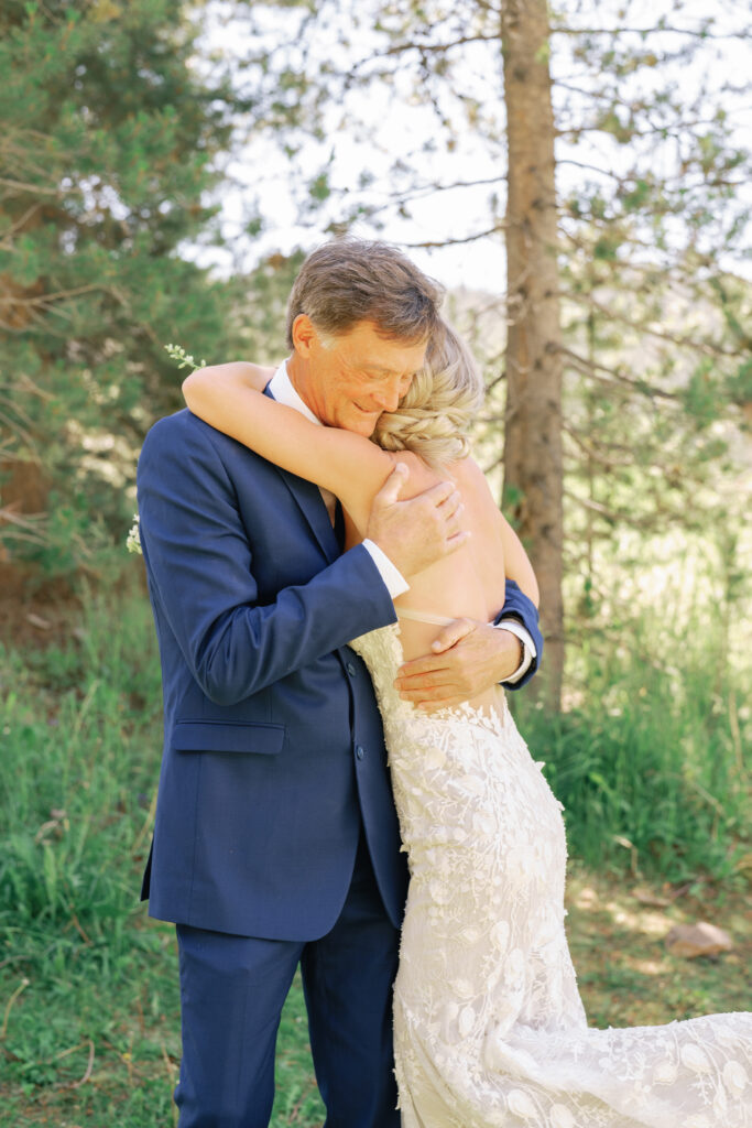 First Look hug with Bride and Father at Galena Lodge in Ketchum Sun Valley