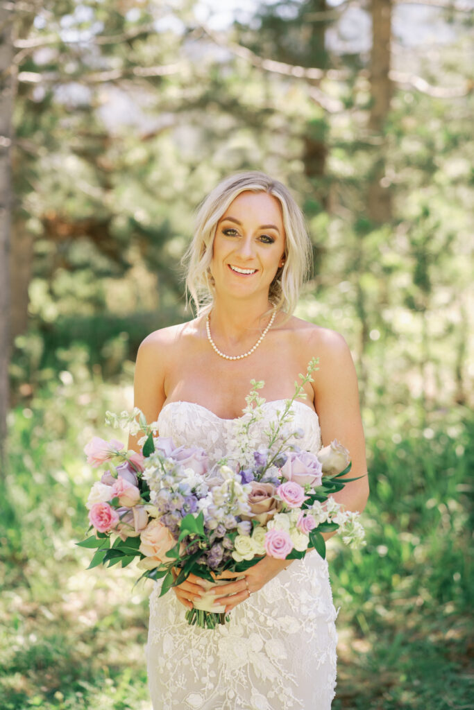 A Bride wearing Made with Love Bridal Gown and florals by Rust and Thistle and BA Makeup for a Sun Valley Wedding