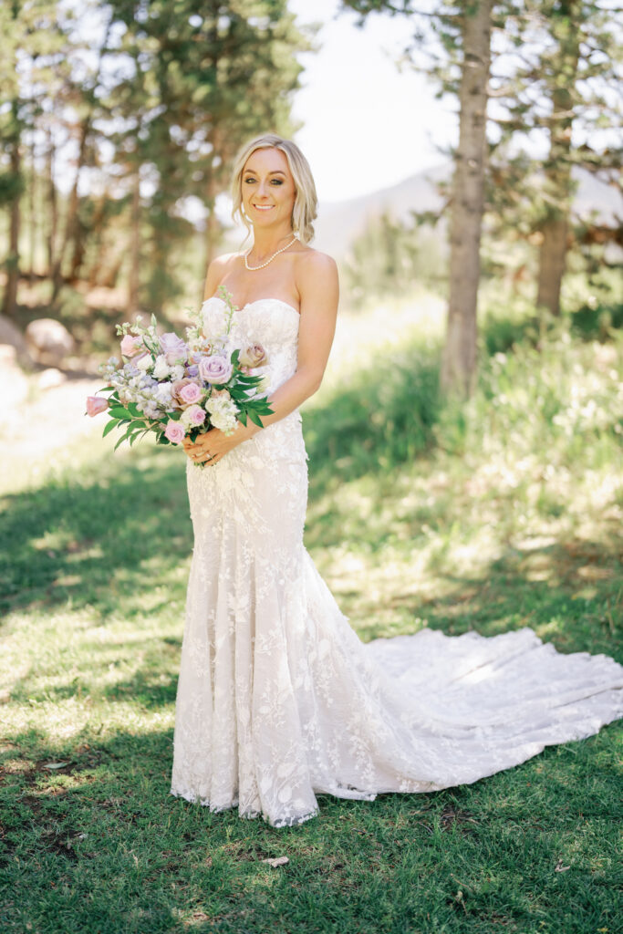Bride wearing Made with Love Bridal Gown and florals by Rust and Thistle for a Sun Valley Wedding