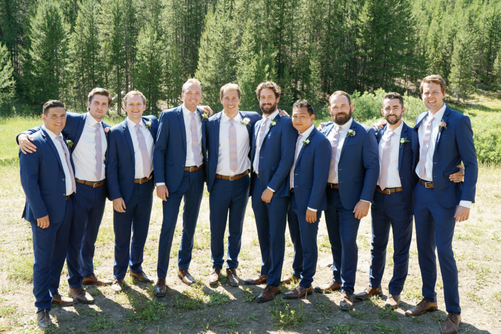 9 Groomsmen in this  Sun Valley's Galena Lodge Wedding wearing Blue Suits from Generation Tux