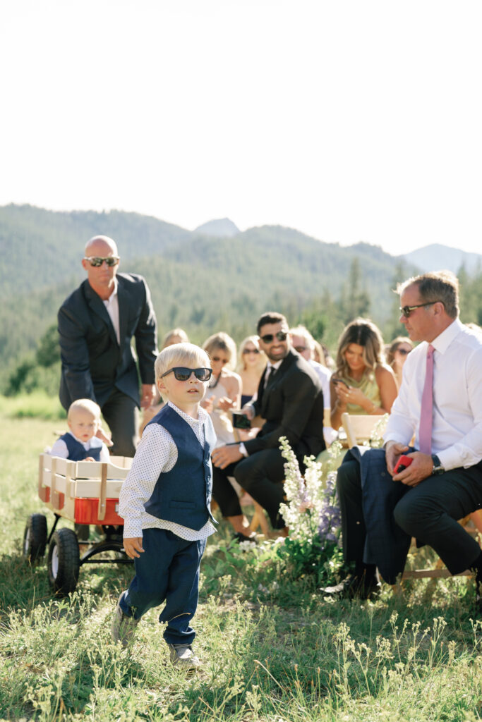 2 ring bearers come down in a wagon Sun Valley  Wedding