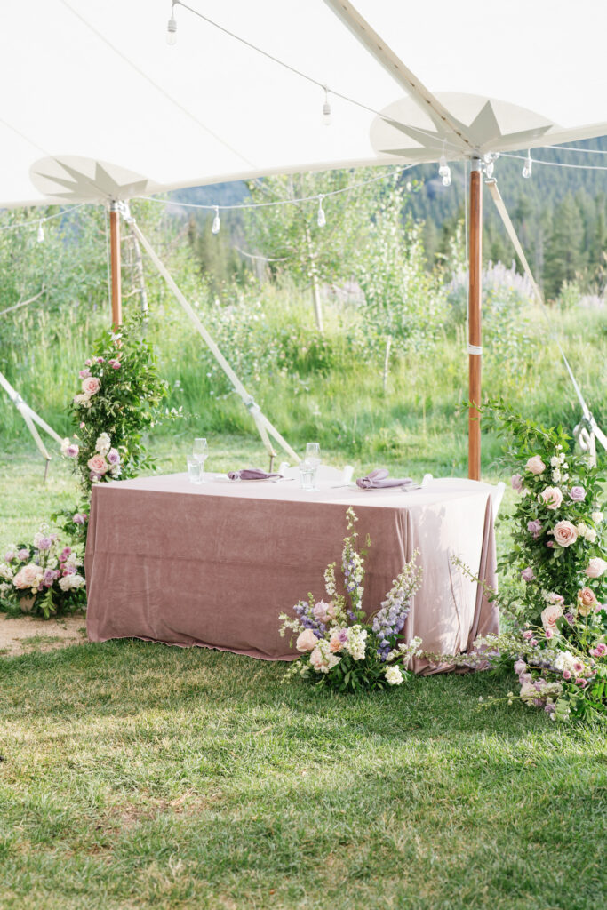 A Sweetheart table dressed with florals by Rust and Thistle with planner  Little Bird Events Boise
