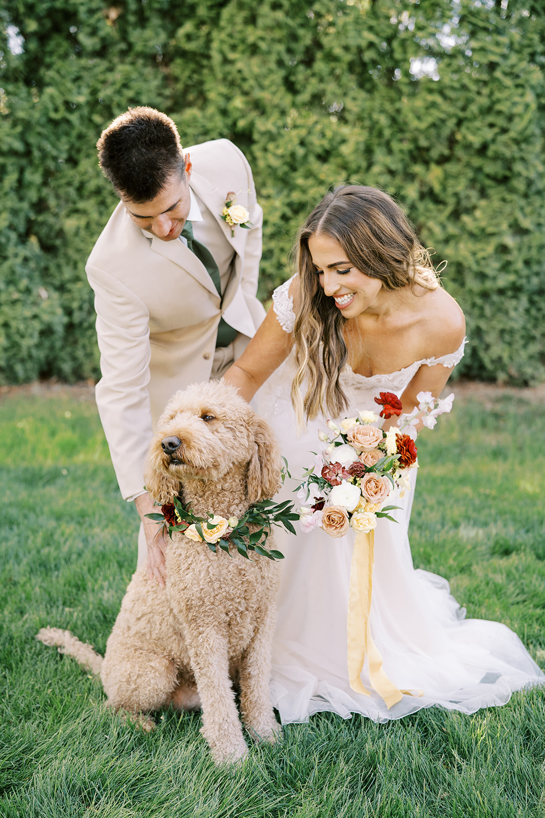 Boise Venue Cottage at Riverbend Bride and groom with goldendoodle dog